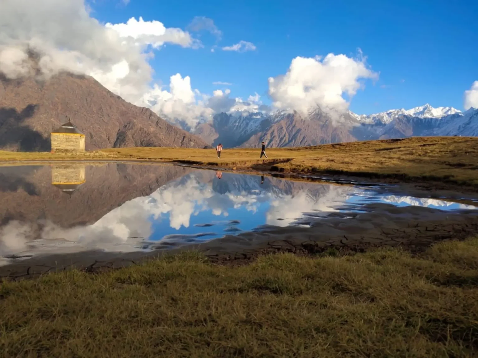 A distant view of Madhyamaheshwar Temple with the vibrant autumn colors of the Garhwal region. 