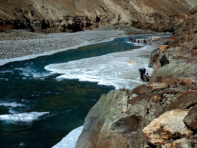 Chadar Trek, one of the most difficult treks in India, surrounded by snow and a frozen lake, showcasing the harsh winter beauty of Ladakh