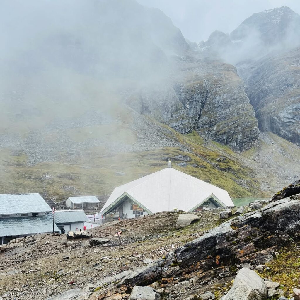 Hemkund Sahib surrounded by foggy Himalayan peaks