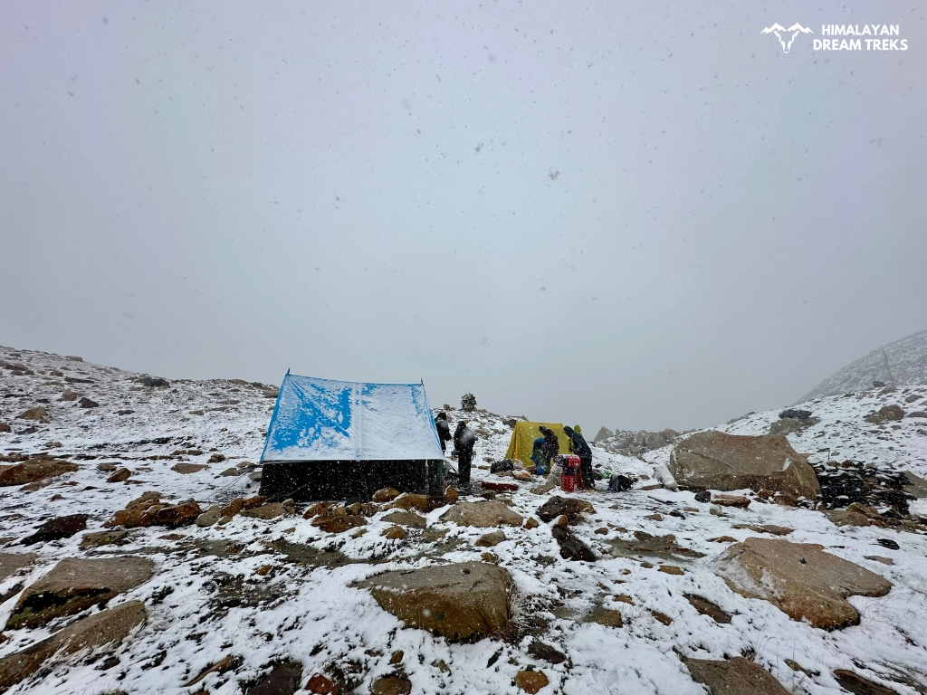 Camping at Nandanvan Vasuki Tal during snowfall in the Himalayas