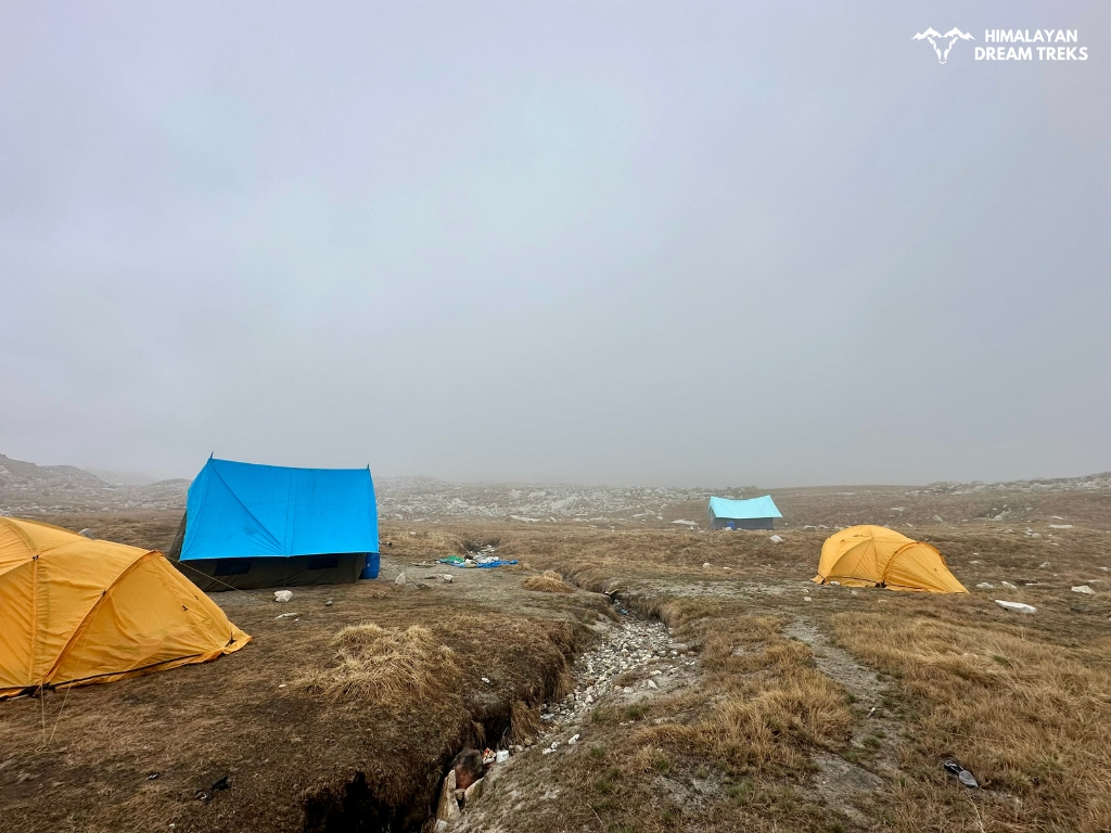 Camping on grassy meadow at Nandanvan during Vasuki Tal trek