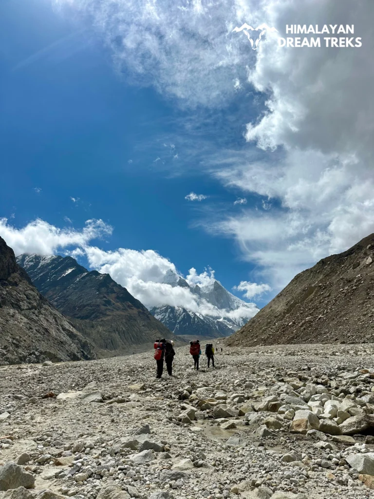 Trekker carrying heavy backpack while trekking to Nandanvan