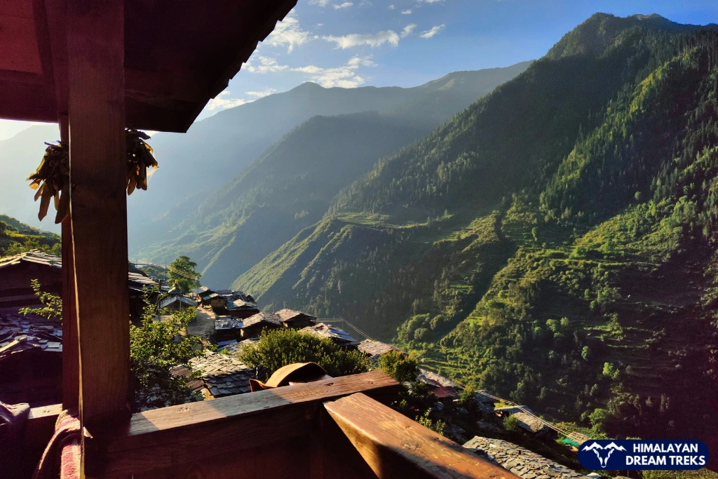Old wooden village houses set in a quiet mountain landscape