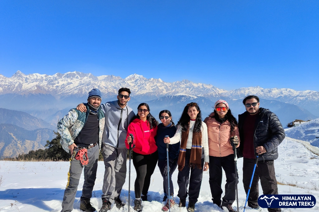 Group of trekkers at the scenic Dayara Bugyal summit