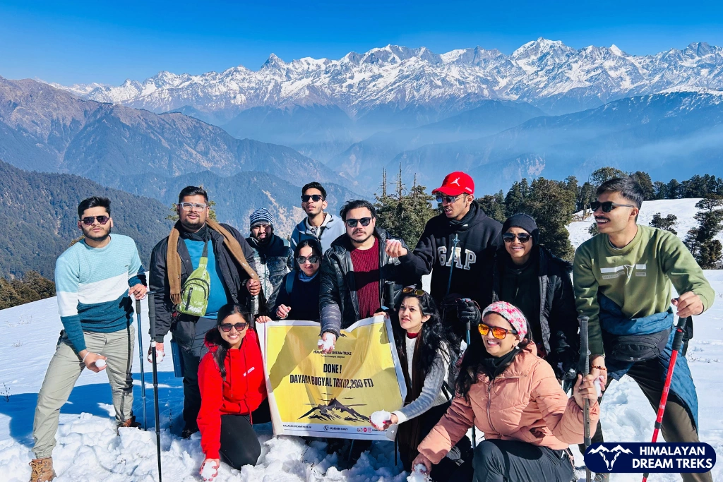Trekkers at the summit of Dayara Bugyal in winter