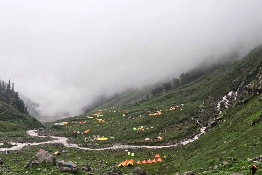 Monsoon clouds drifting over the mountains, adding beauty to the Hampta Pass